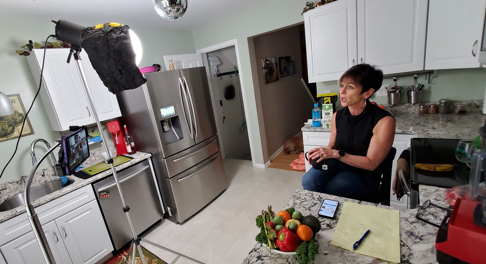 Sally Winchell, wellness director at Bright Side Opportunities Center, conducts an online diet and cooking class from her kitchen. (Source: George Winchell) 