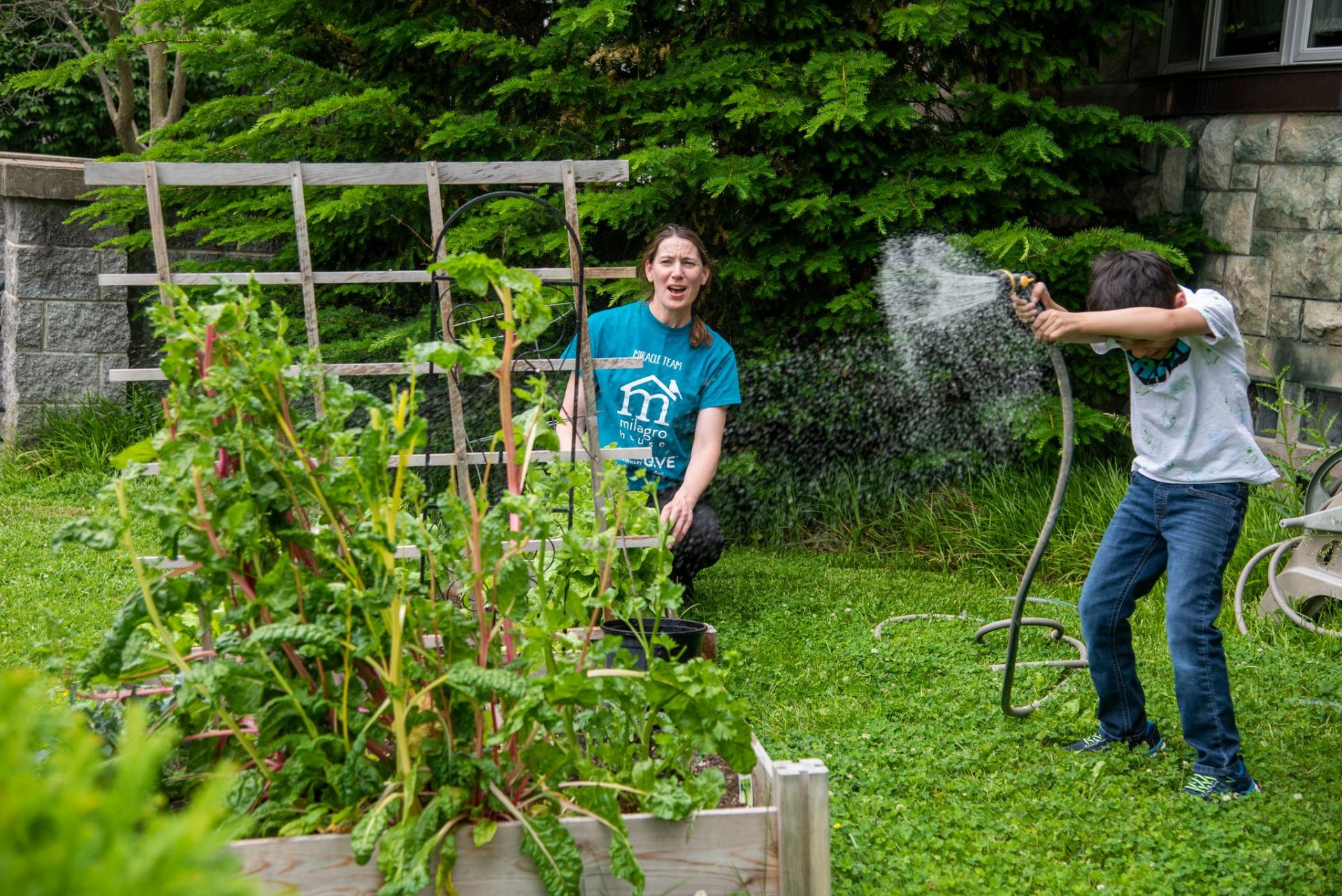 Milagro House Program Director Shiobhian Doherty, and Mason, 8, enjoy a lighthearted moment. (Photo: Fosterjfoster Productions) 