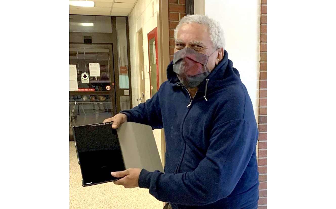 Resident Carl Johnson shows off a computer tablet purchased by the Lancaster City Housing Authority with assistance from a Lancaster Cares grant. (Source: Lancaster City Housing Authority) 