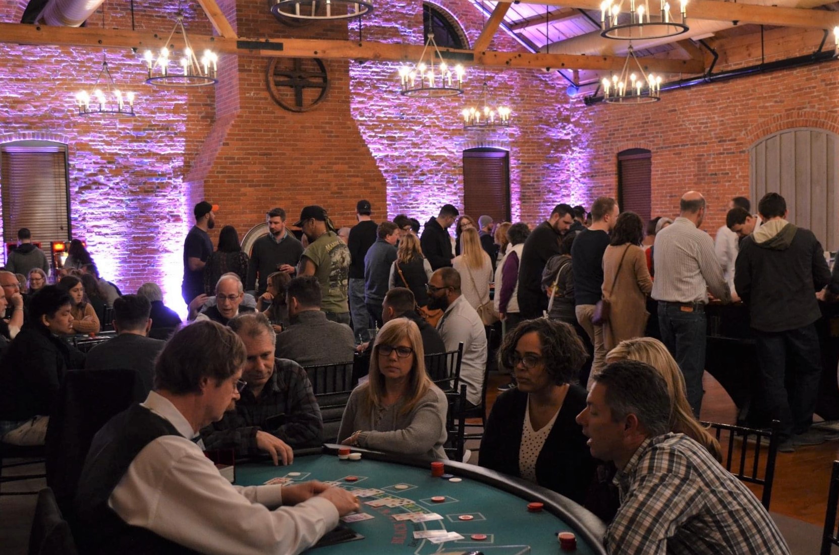 Players take part in a card game at a casino-themed fundraiser for The Mighty Mehal Foundation in February 2020. (Source: Provided)