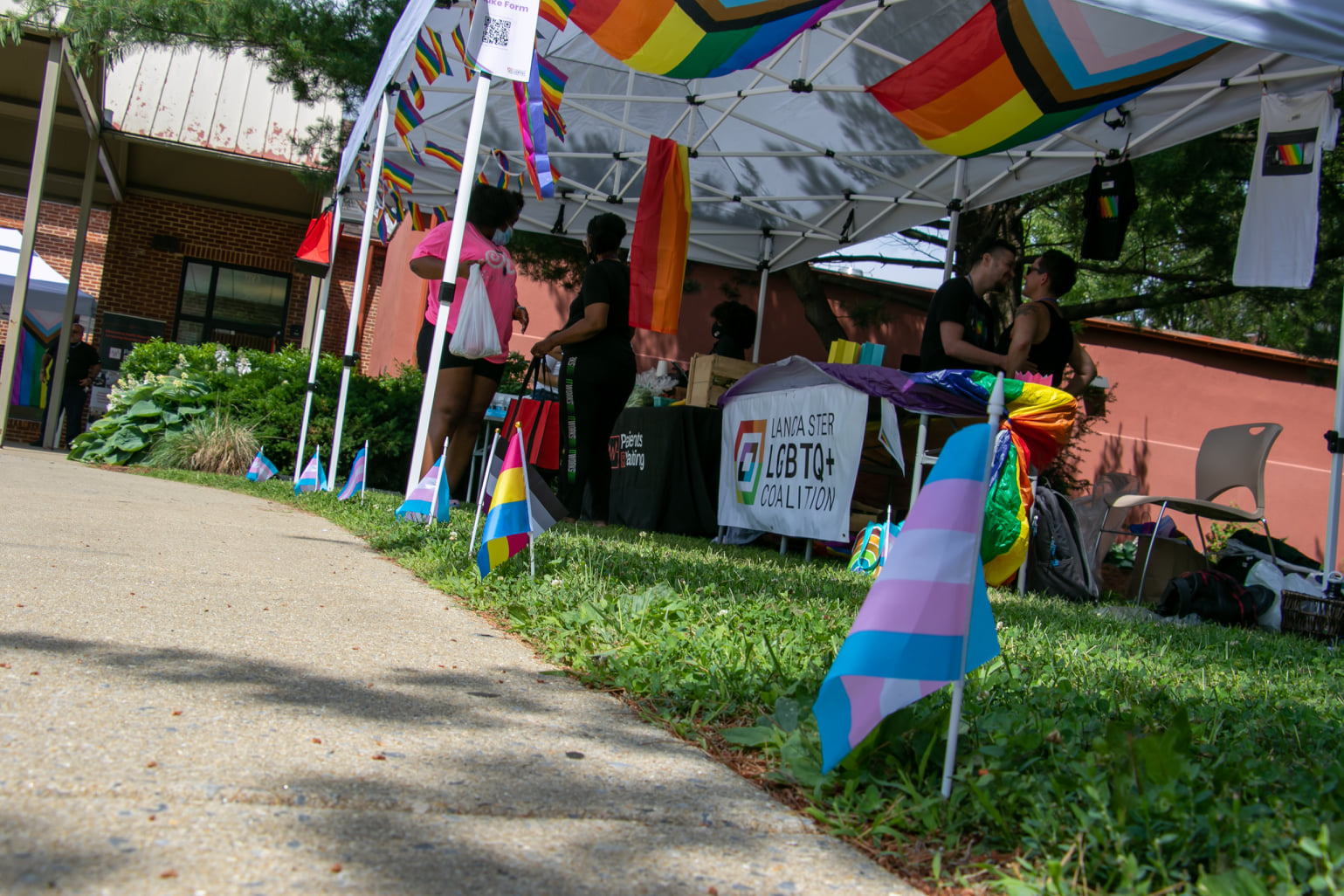 Participants in the LGBTQ+ Vaccine Clinic "Vogue, Vaccines &amp; Visibility" check out the materials at the Lancaster LGBTQ's table on Saturday, June 12, 2021. (Source: Lancaster LGBTQ+ Coalition)