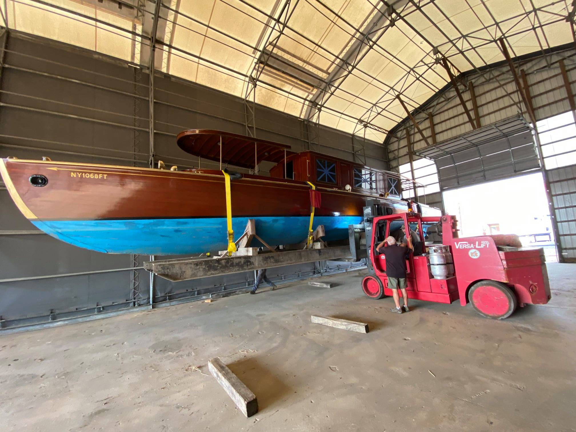 The Chief Uncas is lowered by forklift to the spot where it will spend the winter in storage. (Source: Susquehanna National Heritage Area) 