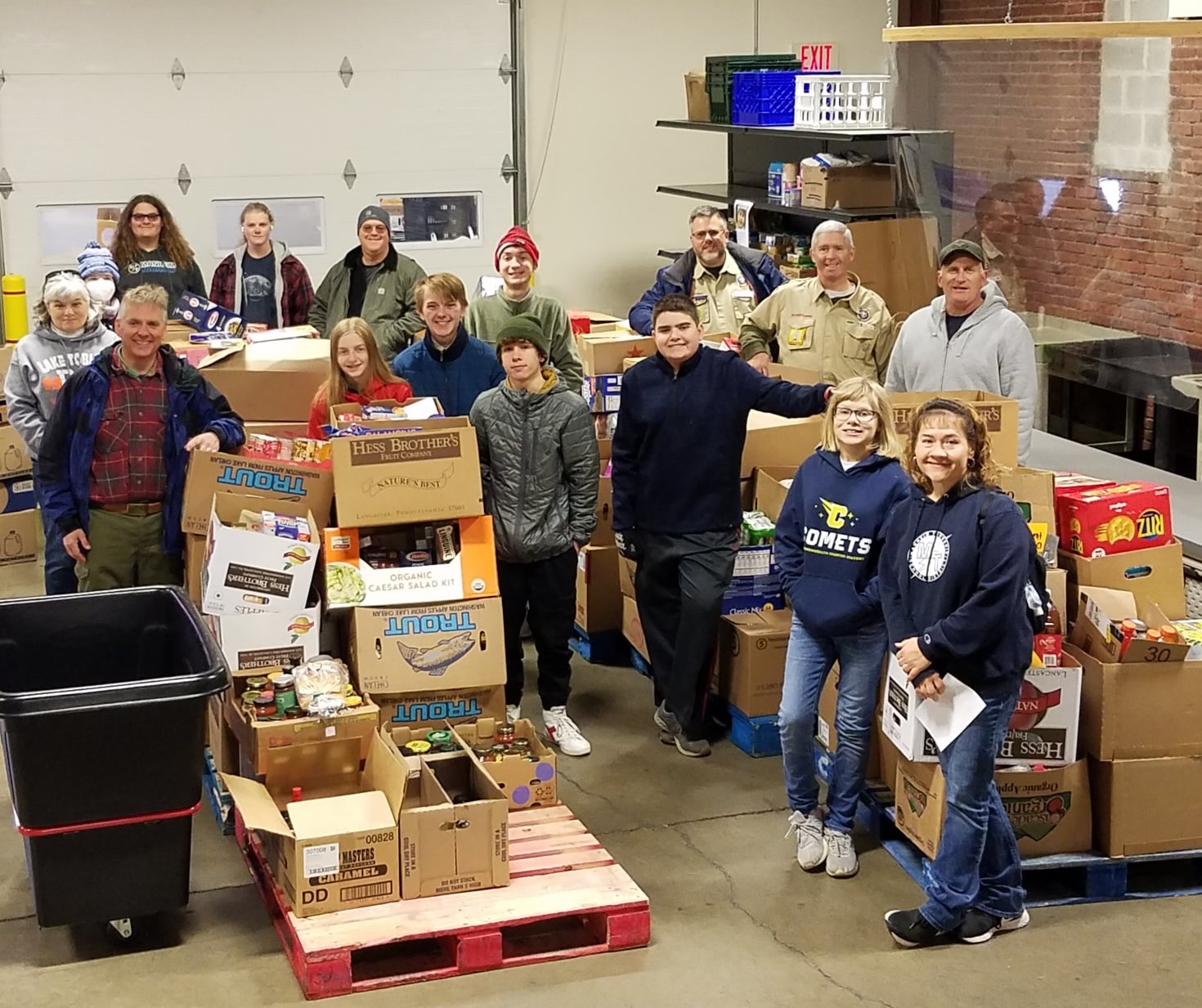 Members of Boy Scouts Troops 33 and 99 pose with food donated to the Lancaster County Food Hub as part of the scouts' annual Scouting for Food drive. (Source: Lancaster County Food Hub)