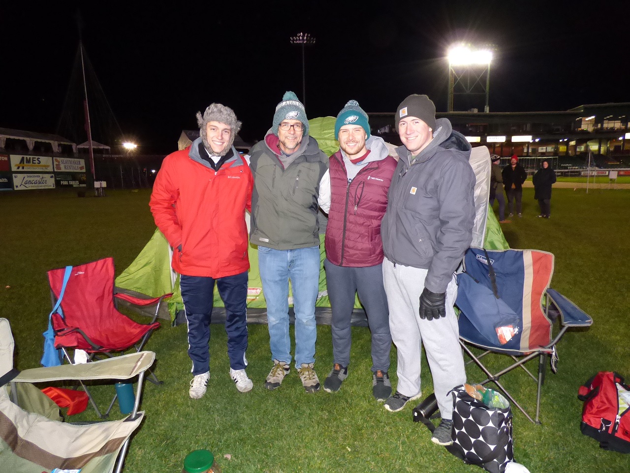 Jonathan Leaman, second from left, and his three sons, from left, Nich, Ben and Zach, take part in Tenfold's Camp Out for Homelessness to Housing. (Photo: Tim Stuhldreher) 