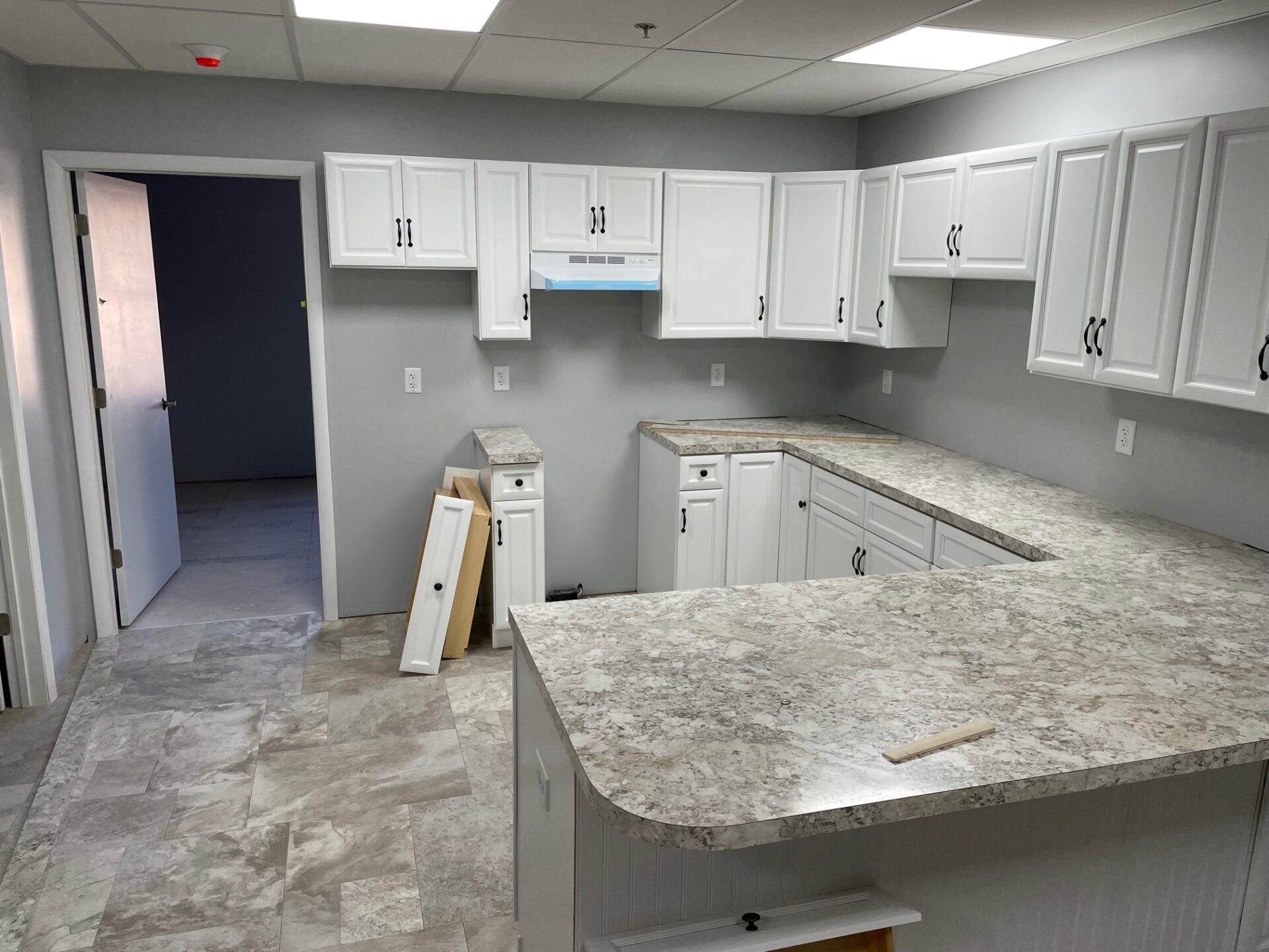 Work progresses on counters and cabinetry in one of the apartments on the upper floor of the new building. (Photo: Kyle Gamble) 