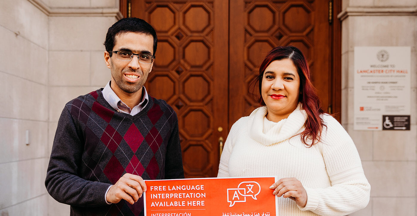 Communication Essentials founder Amer Al Fayadh, left, promotes Lancaster city's interpretation program with Zayra Falu, the city's language services coordinator. (Source: City of Lancaster) 