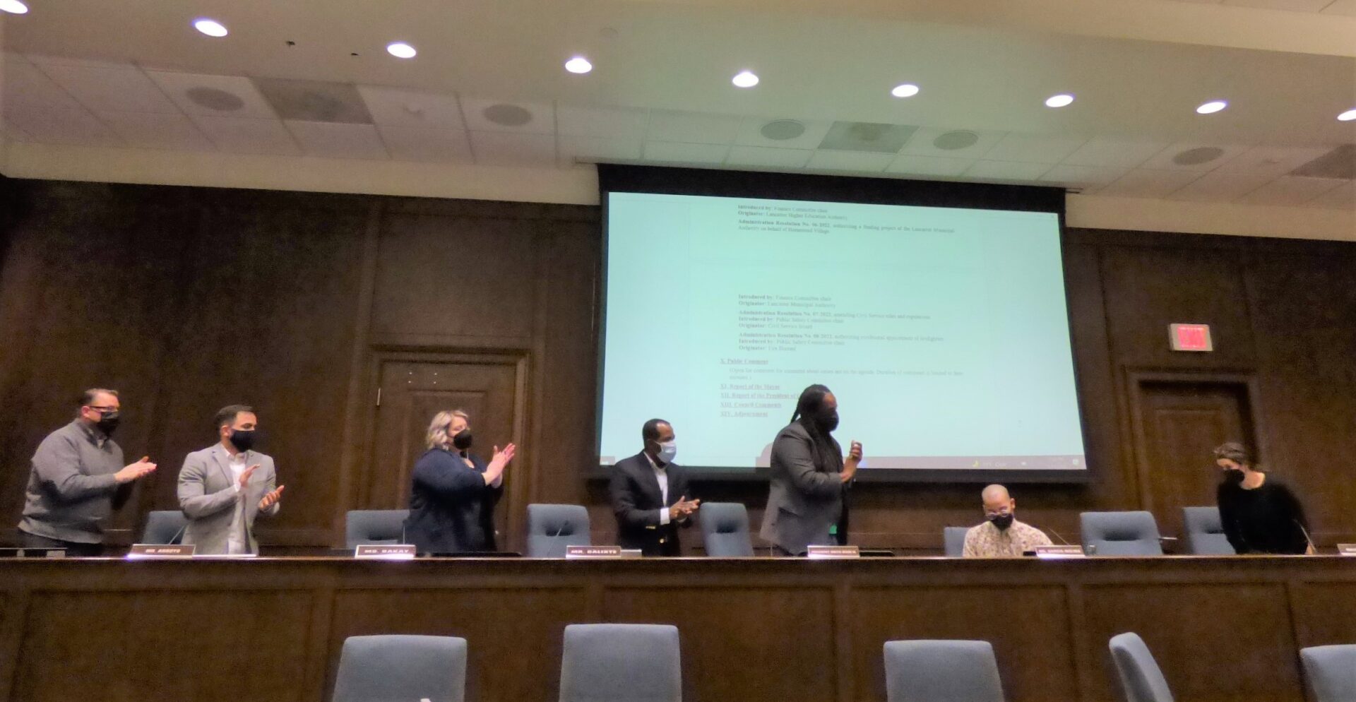 The colleagues of City Councilman Xavier Garcia-Molina, seated, applaud him following his comments in Tuesday's meeting. (Photo: Tim Stuhldreher)