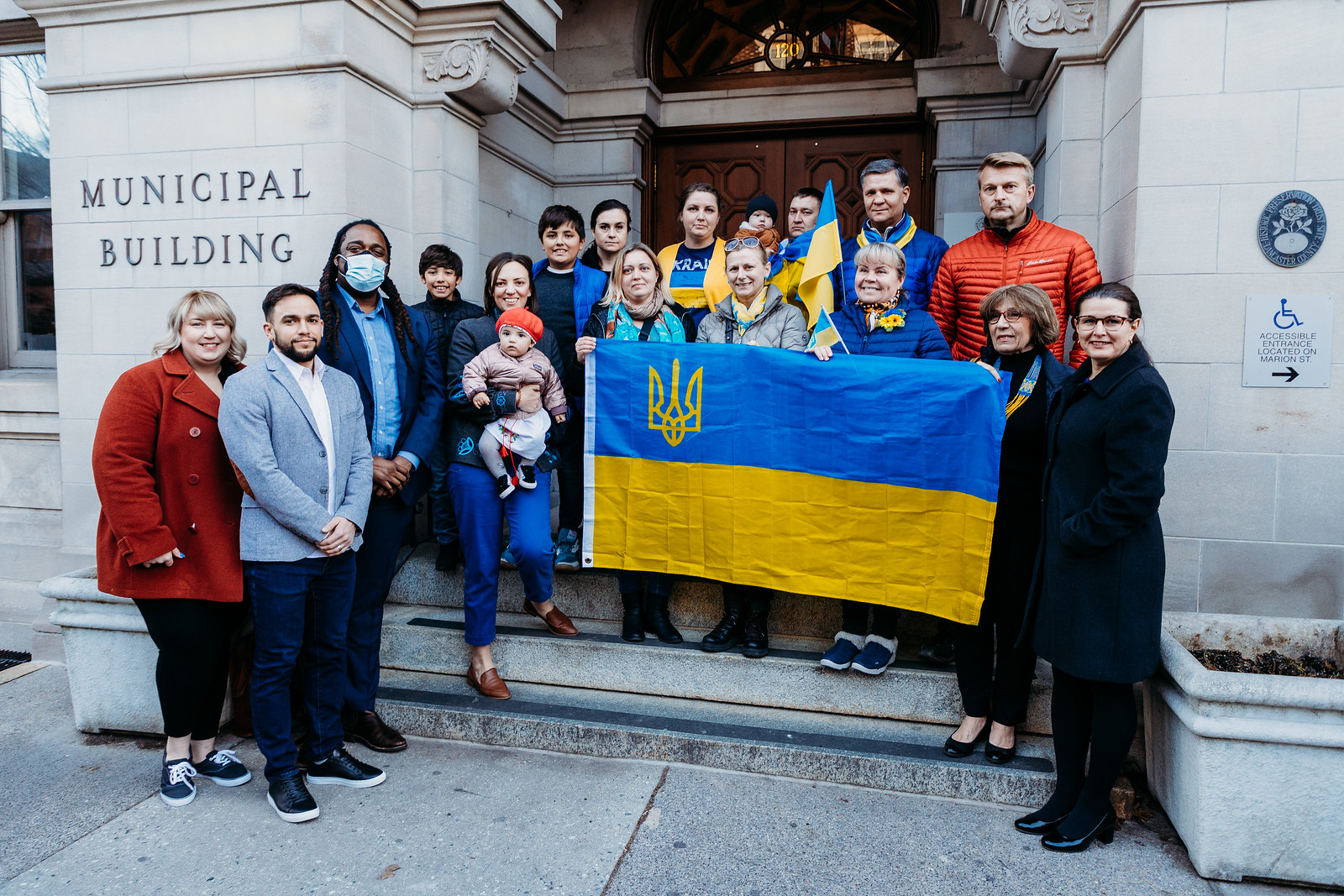 City Council members Amanda Bakay, Jaime Arroyo and Ismail Smith-Wade-El, at left, and Mayor Danene Sorace, right, join members of the Lancaster Ukrainian community to raise the Ukrainian flag outside City Hall on Tuesday, March 8, 2022. (Source: Michelle Johnsen Photography | City of Lancaster)