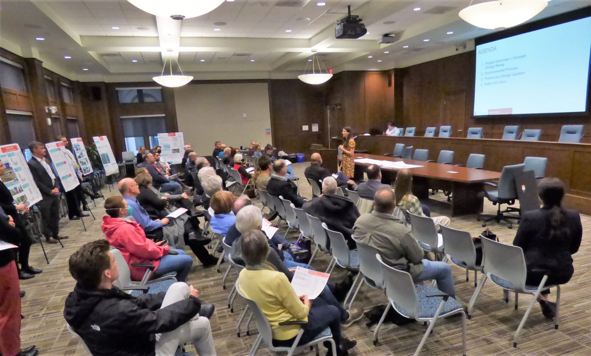 Laura Ahramjian of Kittleson & Associates, standing at center, explains the Water Street bicycle boulevard plans. (Photo: Tim Stuhldreher) 