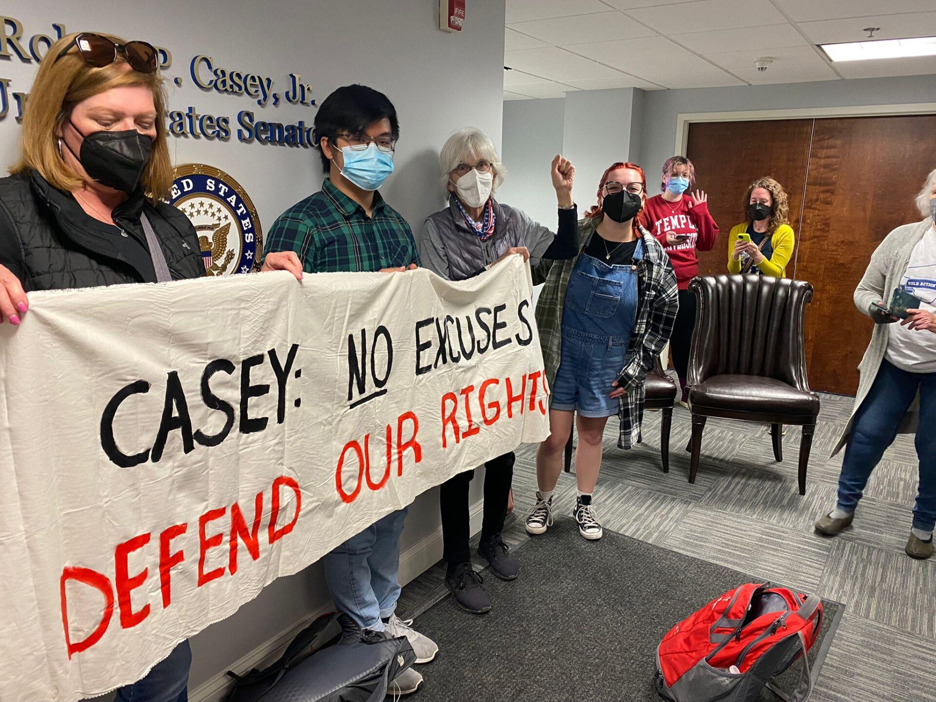 Activists hold up a banner during a protest at the office of U.S. Sen. Bob Casey, D-Pa., on Tuesday, May 10, 2022. (Source: Lancaster Stands Up)