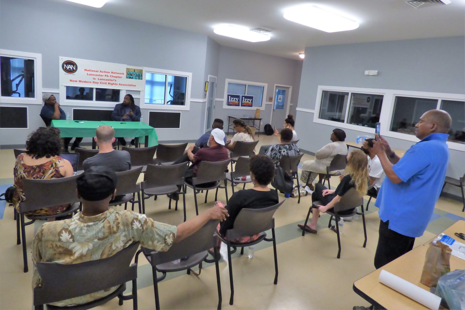 Art Brinton, at left at green table, questions Ismail Smith-Wade-El during a National Action Network candidate forum at Garden Court Apartments in Lancaster on Thursday, May 12, 2022. (Photo: Tim Stuhldreher) 