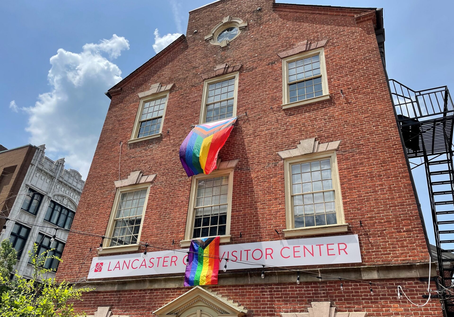 Rainbow flags are unfurled at the Penn Square Visitor Center for Pride Month on Wednesday, June 1, 2022. (Photo: Kyle Gamble)