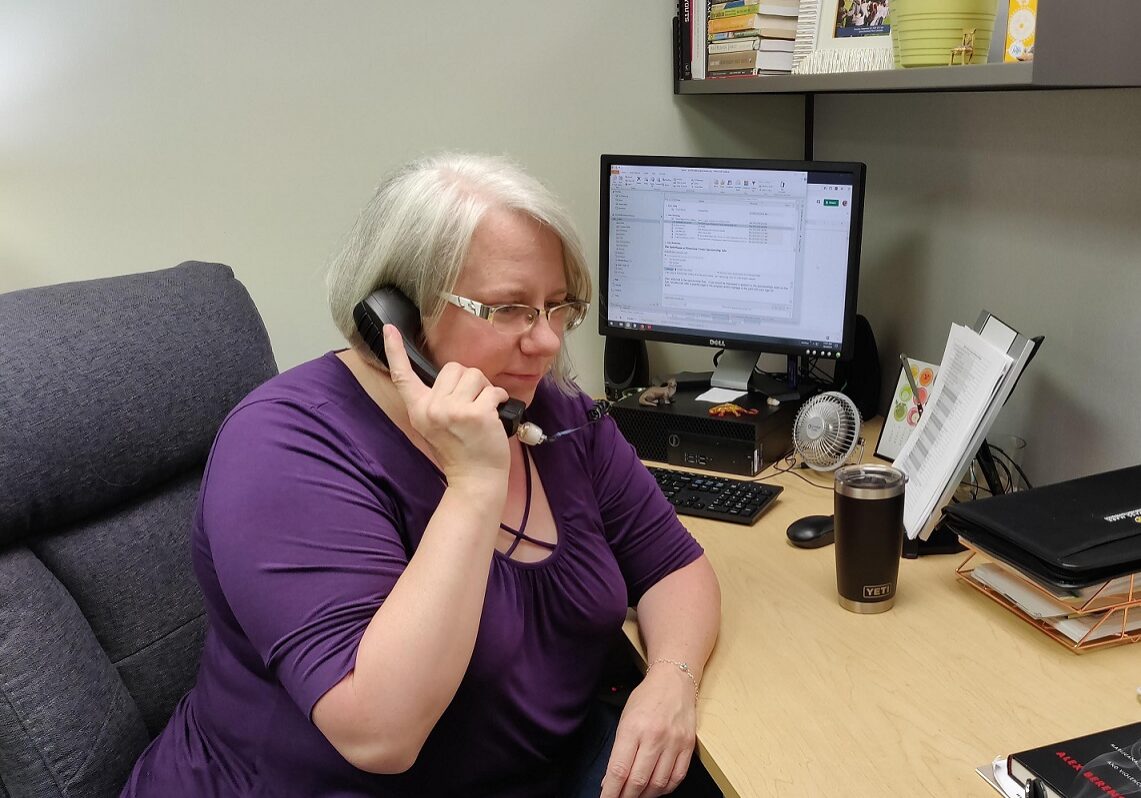 Compass Mark - web Amy Sechrist, certified prevention specialist, answering a call to Compass Mark’s Addiction Resource Center. (Photo: Provided)