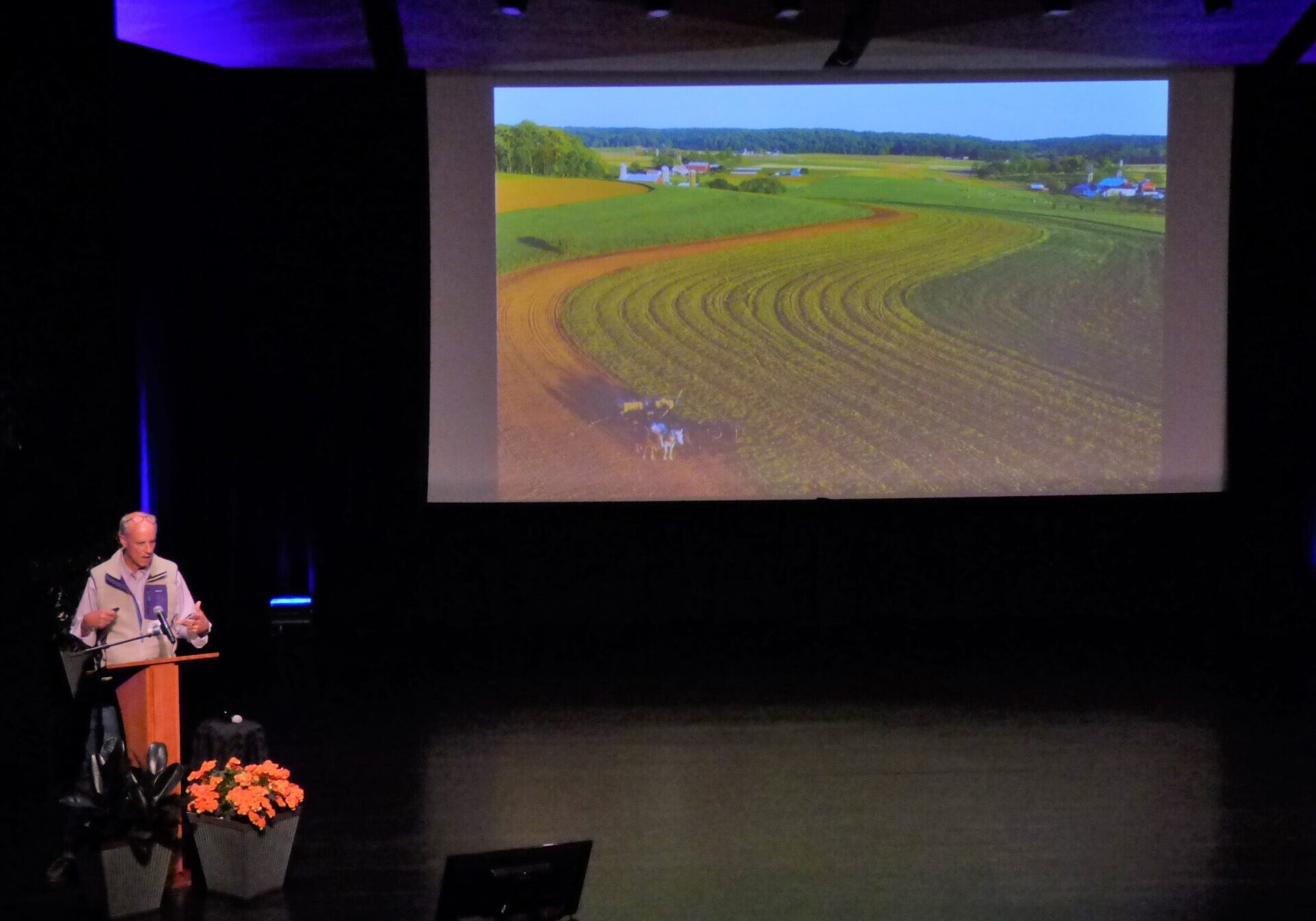 Food - Steinmetz 2 Photojournalist George Steinmetz talks about a drone photo he took of an Amish farm in Lancaster County in his keynote address at the "Food for Thought" forum at the Ware Center in Lancaster on Wednesday, April 27, 2022. (Photo: Tim Stuhldreher)