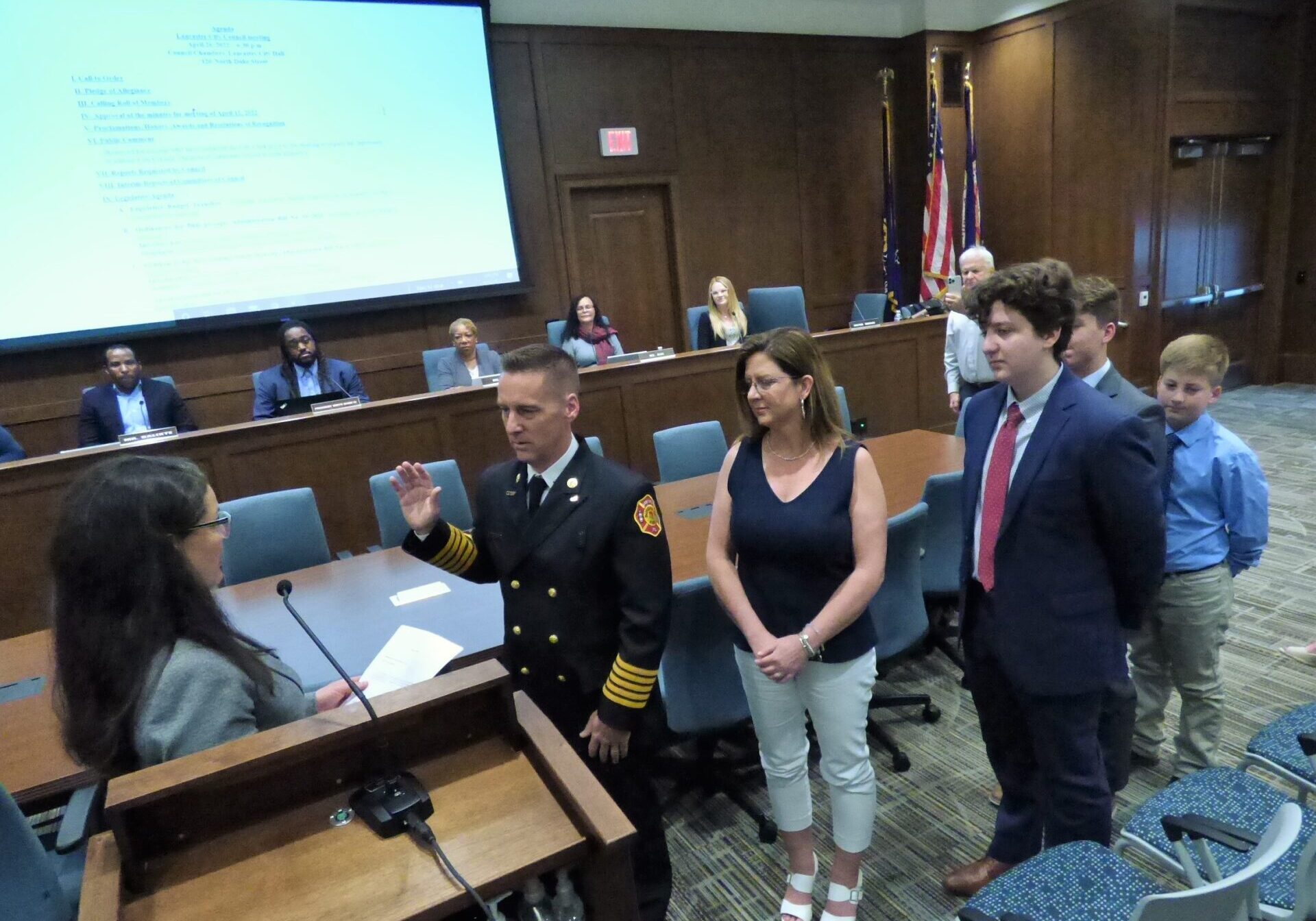 Hutchinson 2 Mayor Danene Sorace administers the oath of office to Fire Chief Todd Hutchinson as Hutchinson's family look on during a City Council meeting on Tuesday, April 26, 2022. (Photo: Tim Stuhldreher)