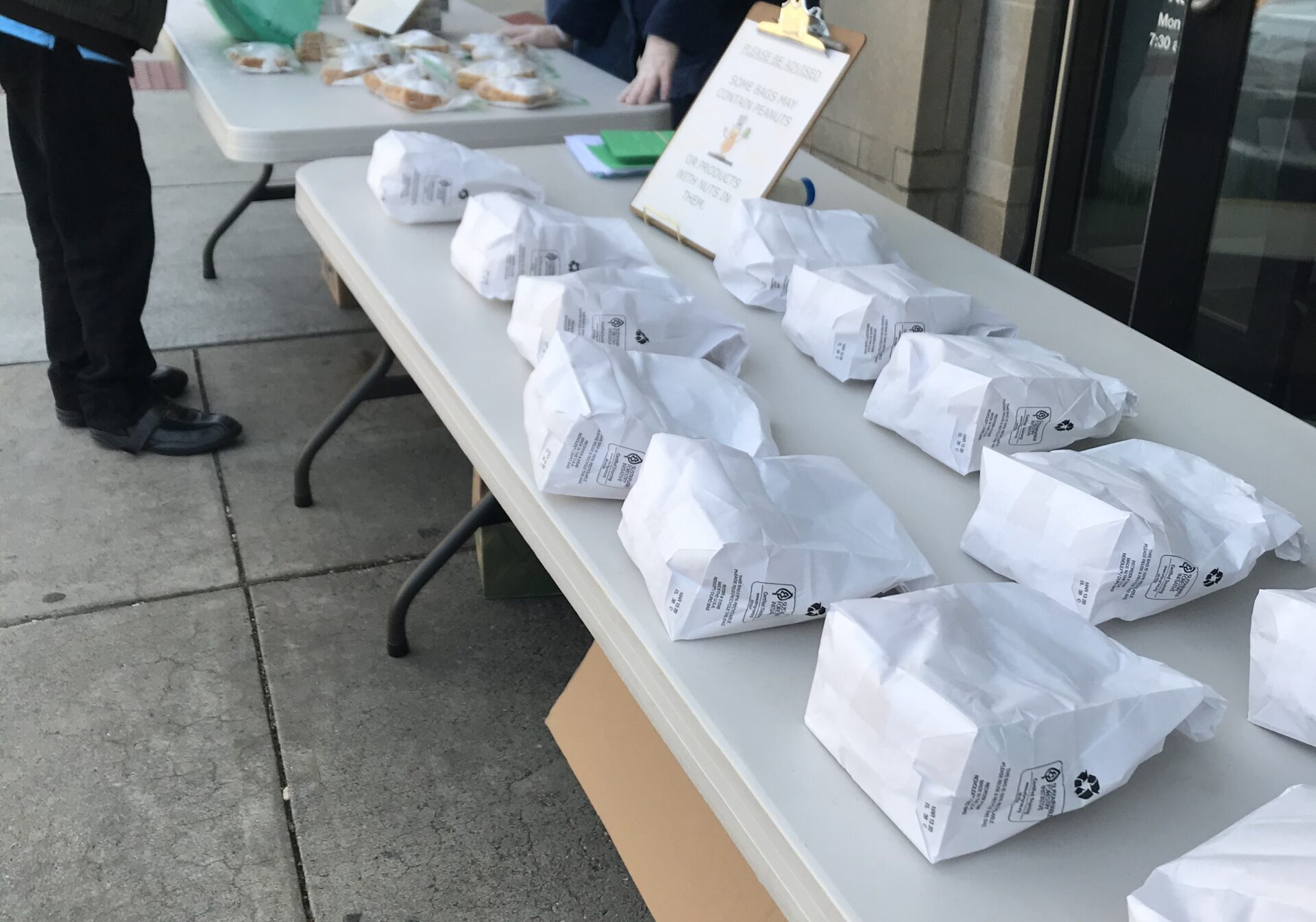 Moravian Center Moravian Center of Lancaster volunteers provide grab-n-go meals at the Center's entrance on North Queen Street, Lancaster. (Source: Moravian Center of Lancaster)