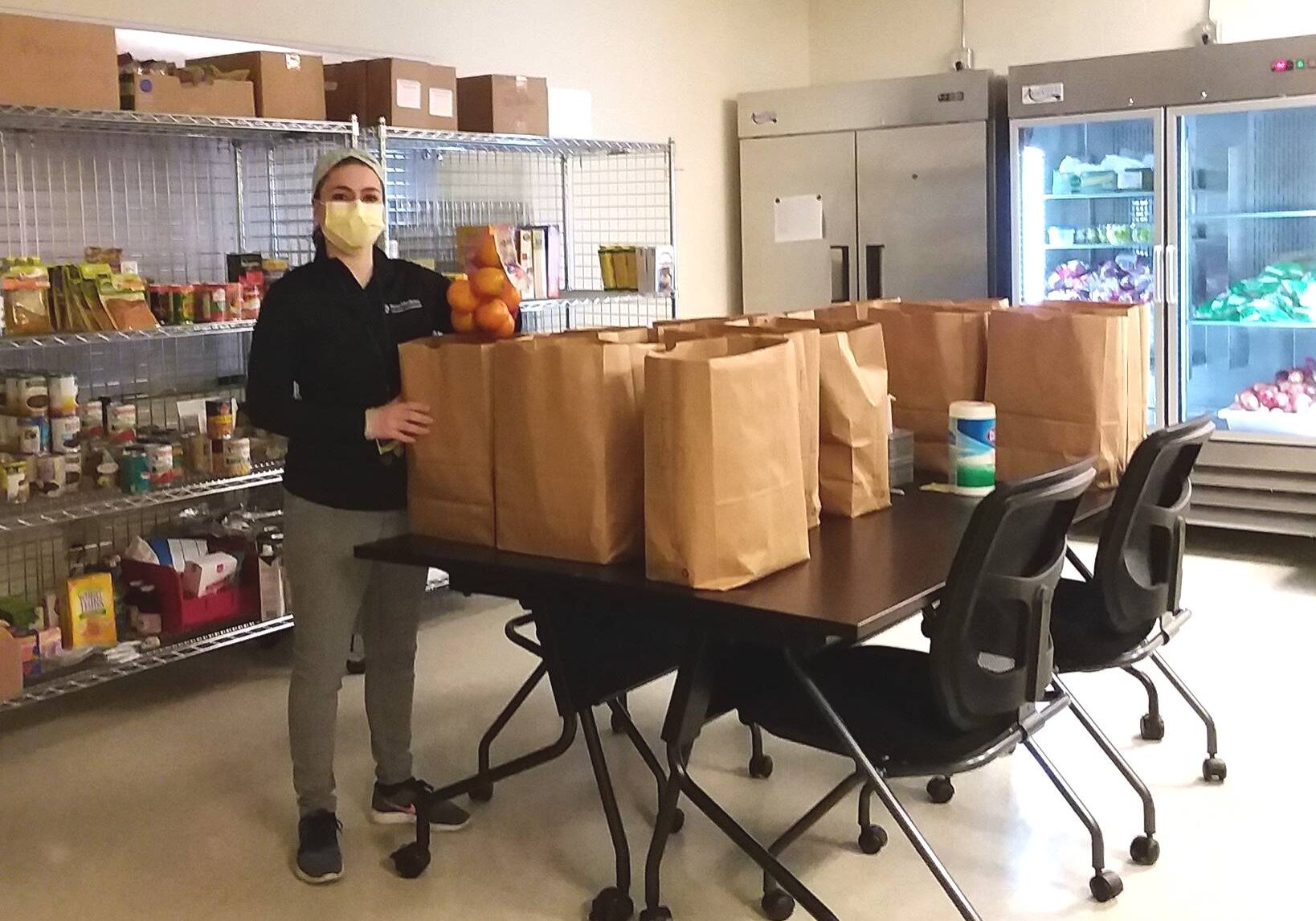 Laura - Food Farmacy - cropped Dietician Laura Sahd wears a mask at the Lancaster County Food Hub. Sahd, of Penn Medicine Lancaster General Health, is community dietician for Food Farmacy, a nutrition counseling pilot program for at-risk individuals. (Photo provided by Lancaster County Food Hub)