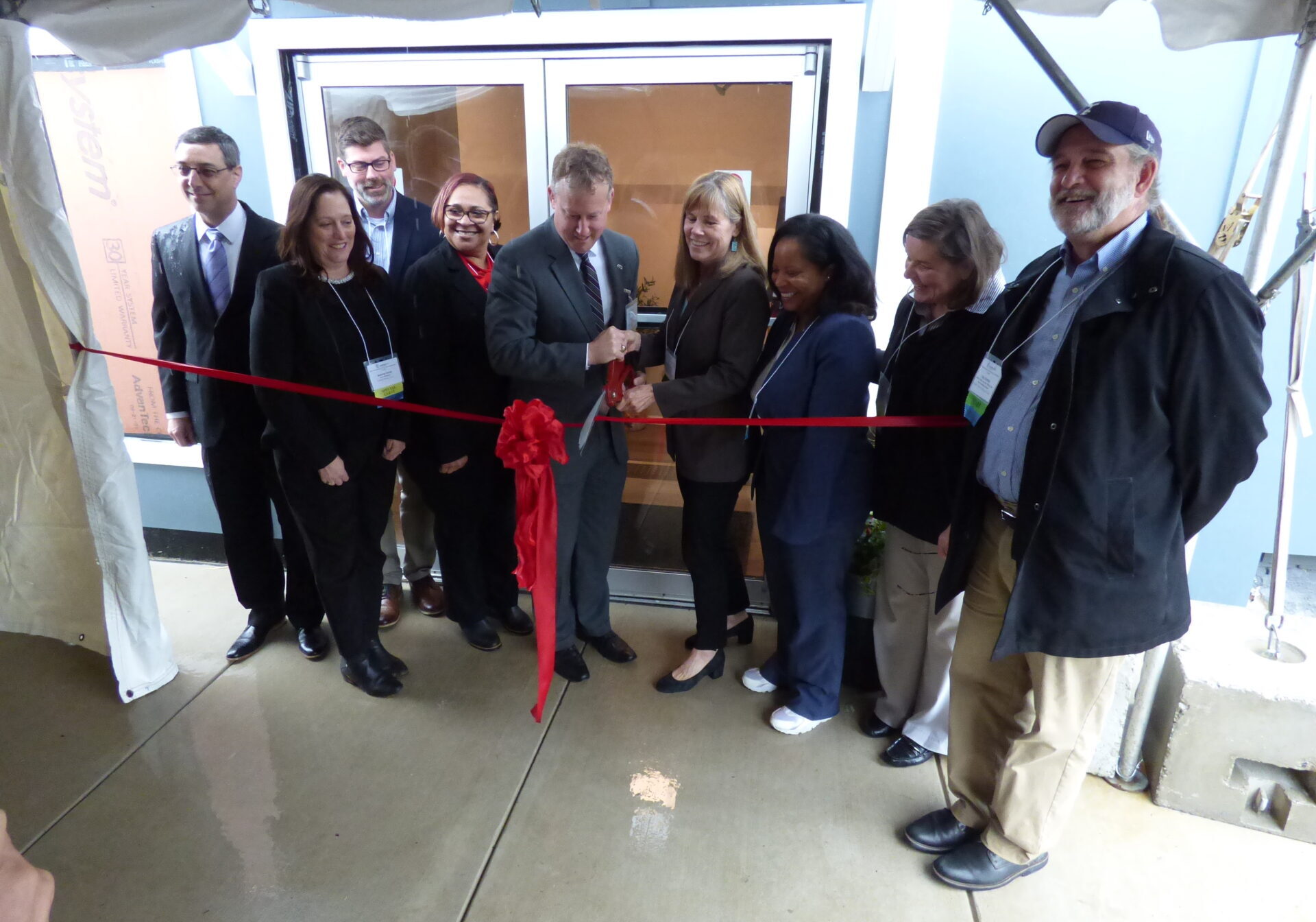 Park Place - Ribbon State Sen. Ryan Aument and Sue McPhedran of Mission First Housing Group, center, cut a ribbon to mark the opening of the newly renovated Park Place Apartments in Elizabethtown on Friday, May 7, 2022. (Photo: Tim Stuhldreher)