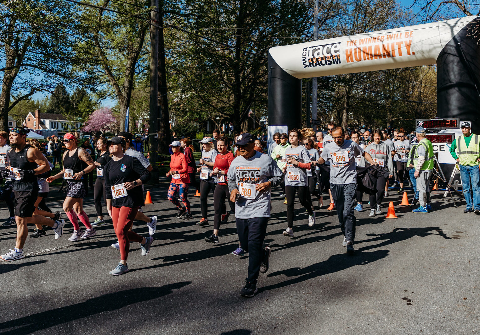 RAR22 17 - MJ Runners head down East Chestnut Street as the 2022 Race Against Racism ges under way on Saturday, April 30, 2022. (Photo: Michelle Johnsen)