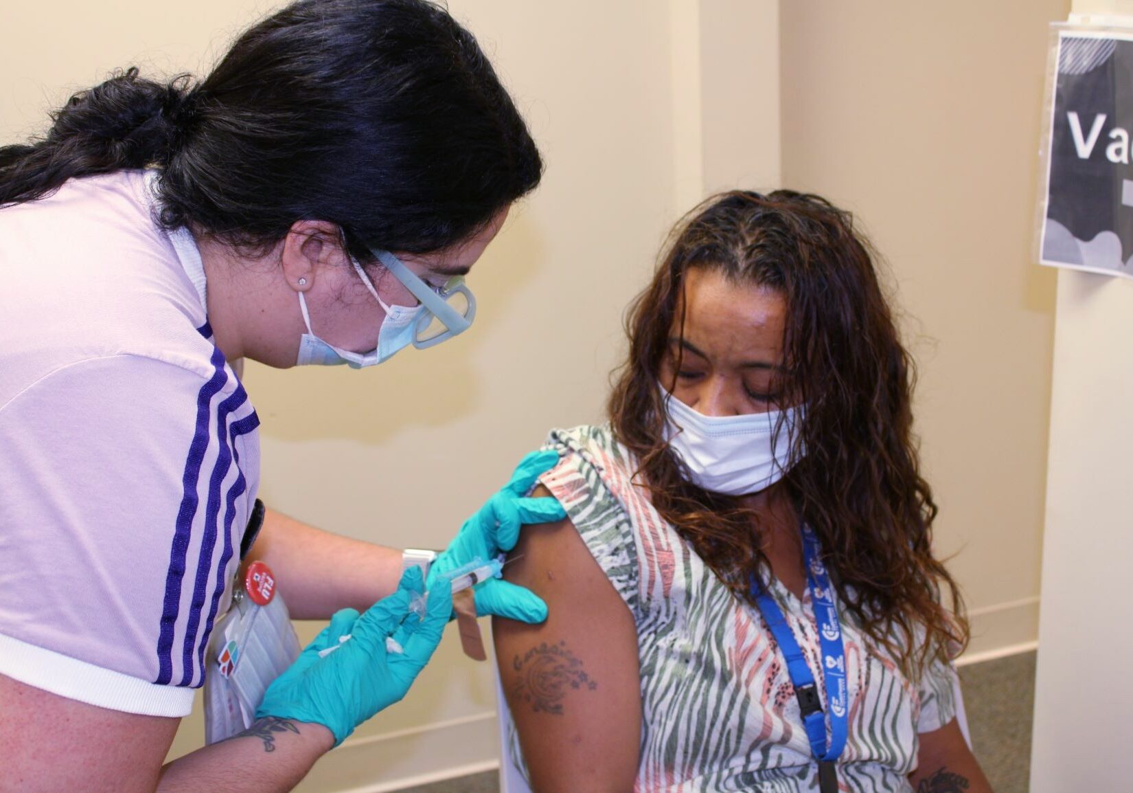 Union Community Care 2 web Certified medical assistant Roselinn Colon-Zayas administers the Moderna Covid-19 vaccine to Jessica Abino-Santiago at Union Community Care's 802 New Holland Ave. office on Friday, June 11, 2021. (Source: Union Community Care)